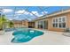 Beautiful backyard pool and jacuzzi are enclosed with see-through roof and back patio at 2202 Hickory Ridge Dr, Valrico, FL 33596
