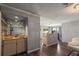Charming bar area with glass shelving and cabinetry, conveniently located near the living spaces at 2584 58Th S Ave, St Petersburg, FL 33710
