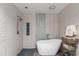 Luxurious bathroom with a standalone tub and a beautifully tiled shower area at 2584 58Th S Ave, St Petersburg, FL 33710