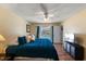 Comfortable bedroom featuring a ceiling fan and direct access to the backyard pool area at 2584 58Th S Ave, St Petersburg, FL 33710