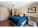 Cozy bedroom with a ceiling fan and closet access to the ensuite bathroom at 2584 58Th S Ave, St Petersburg, FL 33710