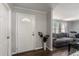 Inviting foyer with decorative front door, wood floors and gray walls at 2584 58Th S Ave, St Petersburg, FL 33710