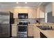 Well-equipped kitchen with stainless steel appliances and ample countertop space at 2584 58Th S Ave, St Petersburg, FL 33710