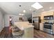 Open-concept kitchen features a breakfast bar with seating and stainless steel appliances at 2584 58Th S Ave, St Petersburg, FL 33710