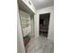 Spacious closet features built-in shelving and leads to a bedroom at 2625 State Road 590 # 1512, Clearwater, FL 33759