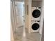 Hallway with new washer and dryer and a view of the updated bathroom at 2625 State Road 590 # 1512, Clearwater, FL 33759