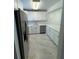 Bright kitchen features white cabinets, stainless appliances, and modern countertops at 2625 State Road 590 # 1512, Clearwater, FL 33759