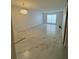 Spacious living room boasts tile floors, and large window for natural light at 2625 State Road 590 # 1512, Clearwater, FL 33759