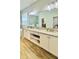 Large bathroom features granite countertop, dual sinks, huge mirror, and plenty of storage at 27312 Edenfield Dr, Wesley Chapel, FL 33544