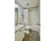 Bathroom featuring granite countertops, vanity with storage, and tub with shower at 27312 Edenfield Dr, Wesley Chapel, FL 33544