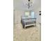 Cozy bedroom featuring plush carpet, natural light, and a contemporary light fixture at 27312 Edenfield Dr, Wesley Chapel, FL 33544