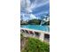 Large community swimming pool with lap lanes, lounge chairs, and a waterslide at 27312 Edenfield Dr, Wesley Chapel, FL 33544