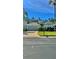 Charming home with a well-manicured lawn, mature landscaping, and a two-car garage at 27312 Edenfield Dr, Wesley Chapel, FL 33544