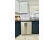 This kitchen features stainless steel appliances, subway tile backsplash, and dark countertops at 27312 Edenfield Dr, Wesley Chapel, FL 33544