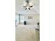 Spacious living room with a ceiling fan and lots of natural light at 27312 Edenfield Dr, Wesley Chapel, FL 33544