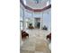 Grand lobby with high ceilings, columns, and seating areas for residents and guests at 27312 Edenfield Dr, Wesley Chapel, FL 33544
