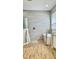 The main bathroom features wood-look tile, a walk-in shower, and a soaking tub at 27312 Edenfield Dr, Wesley Chapel, FL 33544