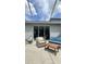 Enjoy the outdoors from this patio area, complete with ample seating and sliding door access to the home at 27312 Edenfield Dr, Wesley Chapel, FL 33544