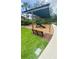 Community playground with shade, playground equipment, and benches on a mulched surface for and families at 27312 Edenfield Dr, Wesley Chapel, FL 33544