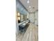 Community restroom featuring multiple sinks, large mirrors, and tiled backsplash at 27312 Edenfield Dr, Wesley Chapel, FL 33544