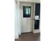 Door to a theater room, with a window providing a glimpse of the interior at 27312 Edenfield Dr, Wesley Chapel, FL 33544