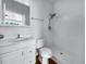 Bright bathroom with a modern vanity, updated fixtures, and a walk-in shower at 2908 Lockwood Meadows Blvd, Sarasota, FL 34234
