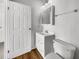 Clean bathroom featuring a modern vanity, a mirror, and wood-look vinyl flooring at 2908 Lockwood Meadows Blvd, Sarasota, FL 34234