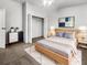 Comfortable bedroom with stylish décor, including a cozy bed, closet space, and soft rug at 2908 Lockwood Meadows Blvd, Sarasota, FL 34234