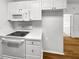 Kitchen featuring modern appliances, white cabinetry and countertops, and tile flooring at 2908 Lockwood Meadows Blvd, Sarasota, FL 34234