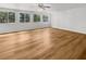 Bright and spacious living room featuring lots of windows for natural light and attractive wood flooring at 2908 Lockwood Meadows Blvd, Sarasota, FL 34234