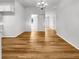An open layout room with vinyl flooring, a chandelier, and neutral-toned walls at 2908 Lockwood Meadows Blvd, Sarasota, FL 34234