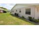 Well-maintained backyard featuring green grass and the side of the property at 402 Dorchester Pl # 44, Sun City Center, FL 33573