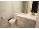 Well-lit bathroom featuring a modern vanity and fixtures at 402 Dorchester Pl # 44, Sun City Center, FL 33573