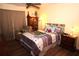 This bedroom includes a plush recliner, hardwood floors and a ceiling fan at 402 Dorchester Pl # 44, Sun City Center, FL 33573