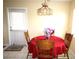 Charming dining area illuminated by a decorative light fixture at 402 Dorchester Pl # 44, Sun City Center, FL 33573