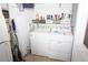 Functional laundry room featuring side-by-side washer and dryer connections and extra storage at 402 Dorchester Pl # 44, Sun City Center, FL 33573