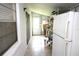 Bright storage area with tiled floors, outside access, and convenient appliance hookups at 402 Dorchester Pl # 44, Sun City Center, FL 33573