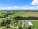 Home with a pool, situated on a well-manicured lot surrounded by green pastures at 40449 Trotter Ln, Dade City, FL 33525
