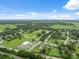 Aerial view showcases the community with adjacent horse race track and residential homes, a beautiful place to live at 40449 Trotter Ln, Dade City, FL 33525