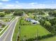 Aerial view of property showing in-ground pool, carport, and landscaping at 40449 Trotter Ln, Dade City, FL 33525