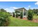 Spacious carport with ample parking for vehicles, adjacent to a well-maintained lawn at 40449 Trotter Ln, Dade City, FL 33525