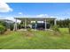 Covered carport with parking for multiple vehicles and a utility trailer in backyard at 40449 Trotter Ln, Dade City, FL 33525