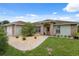 Charming home entrance with decorative brick and well-kept landscaping at 40449 Trotter Ln, Dade City, FL 33525