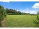 Expansive vacant lot with a lush green lawn perfect for building or recreation at 40449 Trotter Ln, Dade City, FL 33525