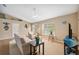 Cozy living room featuring neutral decor, a ceiling fan, and ample natural light at 40449 Trotter Ln, Dade City, FL 33525