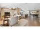 Open-concept living area with tile flooring, neutral decor, and bright lighting at 40449 Trotter Ln, Dade City, FL 33525
