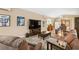 Comfortable living room featuring modern decor, a ceiling fan, and access to other rooms in the house at 40449 Trotter Ln, Dade City, FL 33525
