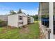 Outdoor sheds for storage, with covered parking and utility vehicle alongside at 40449 Trotter Ln, Dade City, FL 33525