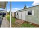 Exterior view of a shed with double doors and ramp for convenient storage at 40449 Trotter Ln, Dade City, FL 33525