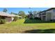 Expansive community lawn with mature landscaping and shared space at 4215 E Bay Dr # 1506C, Clearwater, FL 33764